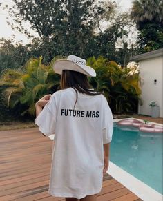 a woman wearing a white t - shirt that says future mrs