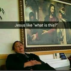 a woman sitting in front of a painting with the words jesus like what is this?