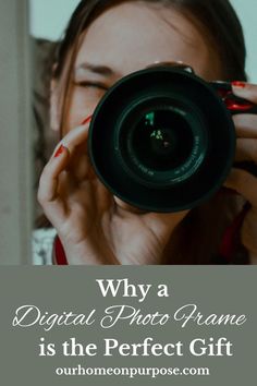 a woman holding up a camera with the words, why a digital photo frame is the perfect gift