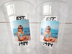 two clear plastic cups with pictures on them