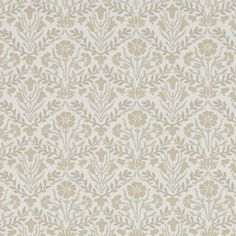 a beige and white wallpaper with small flowers