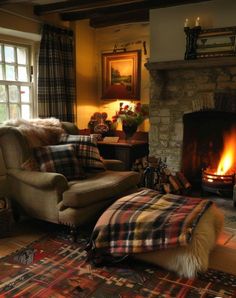 a living room filled with furniture and a fire place