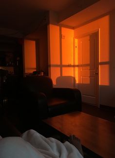 the sun is shining through the windows in this living room