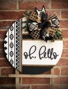 a black and white sign with a bow on it that says o r bello