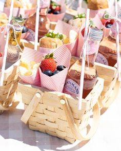 several baskets filled with different types of foods and condiments on top of a table