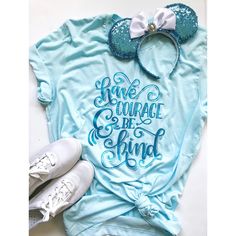 Our exclusive Have Courage & Be Kind shirt is a beautiful message in beautiful metallic blue shimmer on a super soft light blue tee!  Unisex Sizing - if you prefer a fitted tee style, please size down one size. Recommended Care: machine wash cold inside out, tumble dry low heat or hang to dry. See customer care pag Stickers On Instagram, Painted Lavender, Disney Princess Outfits, Be Kind Shirt, Disney Inspired Fashion, Have Courage And Be Kind, Girls Camp, Kindness Shirts, Princess Outfits