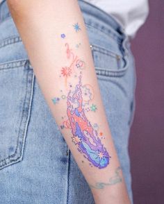 a woman with a colorful tattoo on her arm