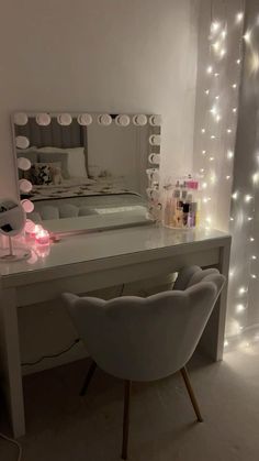 a white desk with a mirror and lights on it