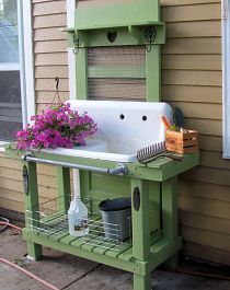 an outdoor sink with flowers on the outside