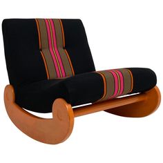 a wooden rocking chair with black fabric and pink stripes on the seat cushion, viewed from the front