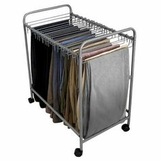 a metal rack with clothes on wheels