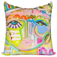 a colorful pillow with an abstract painting on the front and back of it's face