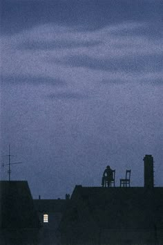 two people sitting on top of a roof at night with the moon in the background