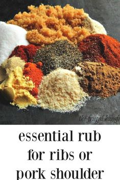 an assortment of spices and seasonings on top of a black surface with the words essential rub for ribs or pork shoulder