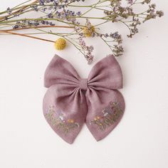 Embroidered linen hair bow is attached to a removable alligator clip and measures approximately 5 1/4 '' x 6 1/2 '' (13,5 cm x 16,5 cm). This item is MADE TO ORDER. Please allow up to 3-7 business days production time before shipping.  Material: 100% medium weight linen, Oeko-Tex 100 certified.