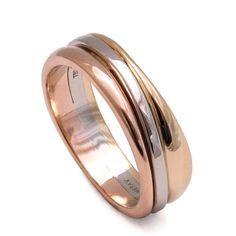 two tone gold and silver wedding rings with matching bands on each side, set against a white background