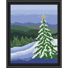 a cross stitch christmas tree with snow on the ground and mountains in the background,