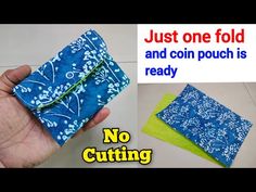 a hand holding a blue and white wallet with the words, just one fold and coin pouch is ready