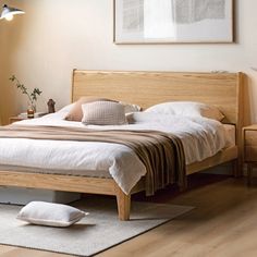 a bed sitting in a bedroom on top of a hard wood floor