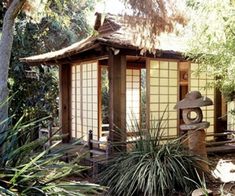 a small building in the middle of some trees