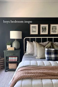 a bed room with a neatly made bed and two pictures on the wall above it