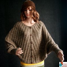 Amazing unusually soft and warm sweater/poncho 2 in 1. It was made from double fiber of baby alpaca wool in beige/brown colour. Very good quallity and luxury fiber and made with attention to details. It is oryginal pattern and design. It comes with buttons Size: L to XL (petite XL) Dimension: length 60 cm, width 70 cm, length of sleeve 79 cm (welt) Alpaca wool is one of the most valuables fibres. Is strong and do not need to be thick to make you warmer. Woven alpaca is water resistant and highly Elegant Oversized Brown Cardigan, Elegant Brown Oversized Cardigan, Cozy Brown Alpaca Poncho, Cozy Brown Wool Poncho, Oversized Brown Wool Poncho, Hand Knitted Beige Poncho For Fall, Brown Hand Knitted Winter Poncho, Hand Knitted Brown Poncho For Fall, Hand-knitted Brown Poncho For Fall