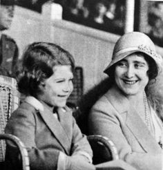 two women sitting next to each other in chairs and one is smiling at the camera