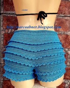 there is a mannequin wearing a blue crochet shorts with black lace