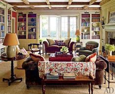 a living room filled with furniture and bookshelves