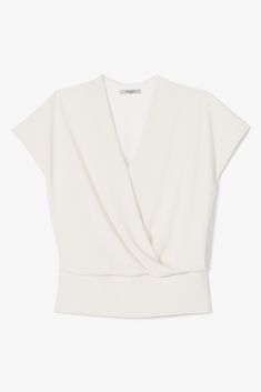 This polished V-neck top combines T-shirt-level comfort with a machine-washable, ever-so-slightly-textured Japanese fabric that doesn’t wrinkle. A draped front panel offers a relaxed fit through the midsection, while a fitted seam at the waist creates definition. This piece has been treated with Polygiene®, an anti-odor finish. The fabric won’t hold smells, so you can wear your piece multiple times before tossing it in the washing machine. Machine Washable Lightweight Odor Resistant Perfect for Modern V-neck Top For Spring, Chic White V-neck Wrap Top, Chic White V-neck T-shirt, Modern V-neck Tops For Summer, Elegant V-neck T-shirt For Workwear, Versatile Fitted V-neck Top, Modern V-neck Tops For Work, V-neck T-shirt For Work, White Fitted Top V-neck T-shirt