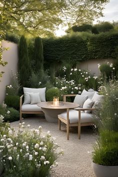 an outdoor seating area with white flowers and greenery