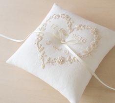 a white pillow with a heart on it