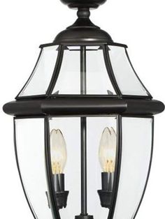 an outdoor light fixture with two lights on it