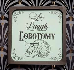 a sign that says live laugh lobotomy on the side of a building