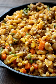 a skillet filled with macaroni and vegetables