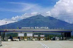 a gas station with a mountain in the background