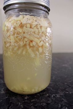 a jar filled with food sitting on top of a counter