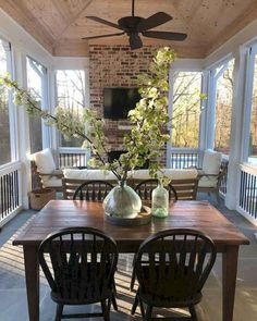 a dining room table with chairs and a ceiling fan