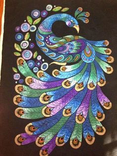 an image of a peacock painted on a piece of cloth