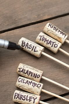 several wine corks with writing on them