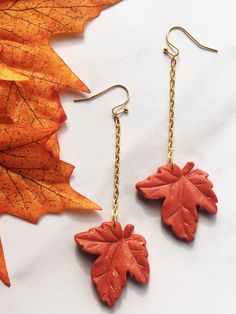 Rhea features: Gold Plated Brass Ball End Ear Wire (Nickel & Lead Free) Orange Polymer Clay Maple Leaf Gold Plated Chain Additional Details: Size: Length (top of Ear wire to bottom of leaf)=2.25 inches Width (widest part) = 1.0 Inch Weight: 0.2oz Each product is handmade in small batches. Since these earrings are all made by hand, slight variations, imperfections and differences may occur. The color displayed on your screen may differ slightly from the clay's color in real life. Orange Polymer Clay, Clay Jewelry Diy, Fall Earrings, Holiday Earring, Orange Gold, Gold Plated Chains, Leaf Earrings, Autumn Inspiration, Small Batches