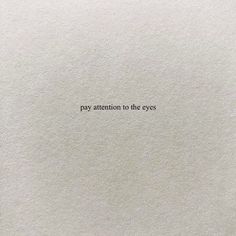 the words pay attention to the eyes are written in black ink on white paper,