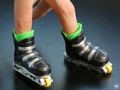 a close up of a person's feet with roller skates on the ground