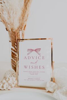 there is a sign that says advice and wishes next to some dried flowers in a vase