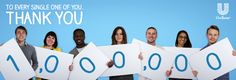 a group of people holding up signs with the words thank you written in blue on them