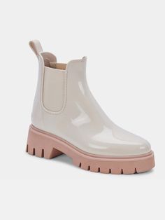 The Stormy Rainboots are ready for whatever rainy weather you can throw at them - all without losing style points. This light-colored rain bootie pairs perfectly with leggings, skinny jeans, or your favorite mini skirt. DETAILS 90% plastic + 10% textile upper Rubber outsole Synthetic sock Fabric lining 9.6" leg circumference 1.3" heel height BRAND Dolce Vita Rain Boots Women, Chelsea Rain Boots, Trendy Boots, Boots White, Rain Or Shine, Rain Boot, Dolce Vita Shoes, Shoes Booties, Waterproof Boots