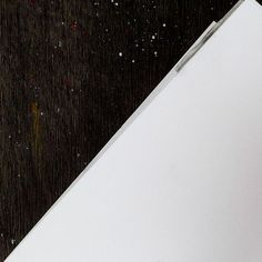 a white refrigerator sitting on top of a wooden floor