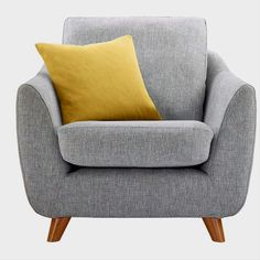 a grey chair with a yellow pillow on the armrests and wooden legs, in front of a white background