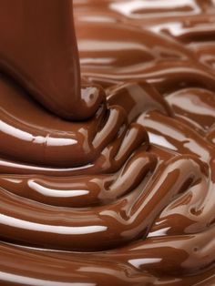 chocolate flowing in the air on top of each other