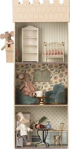 a doll house with furniture and accessories in it